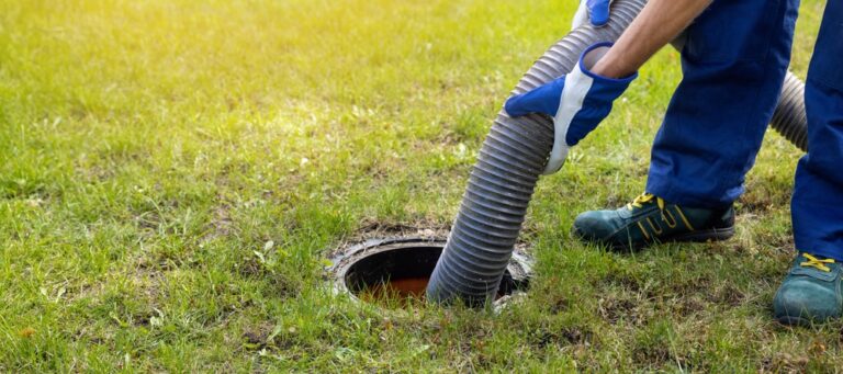 Ortiz Plumbing Plumber pumping out house sewer tank.